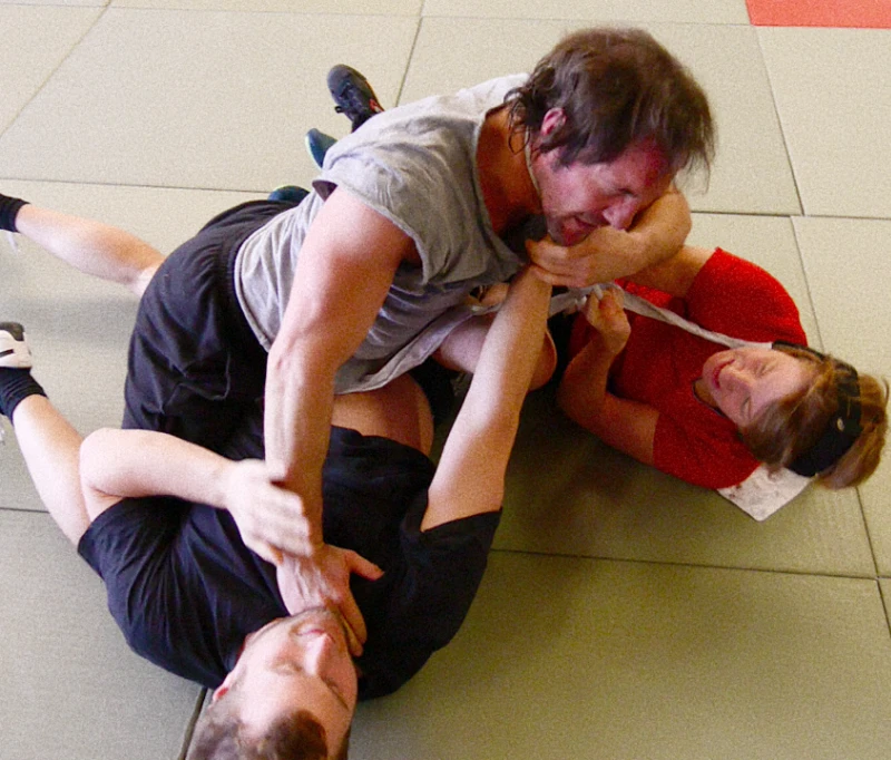 Marco and Anna demonstrating grappling technique