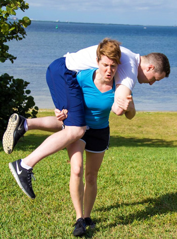 Woman carrying a man